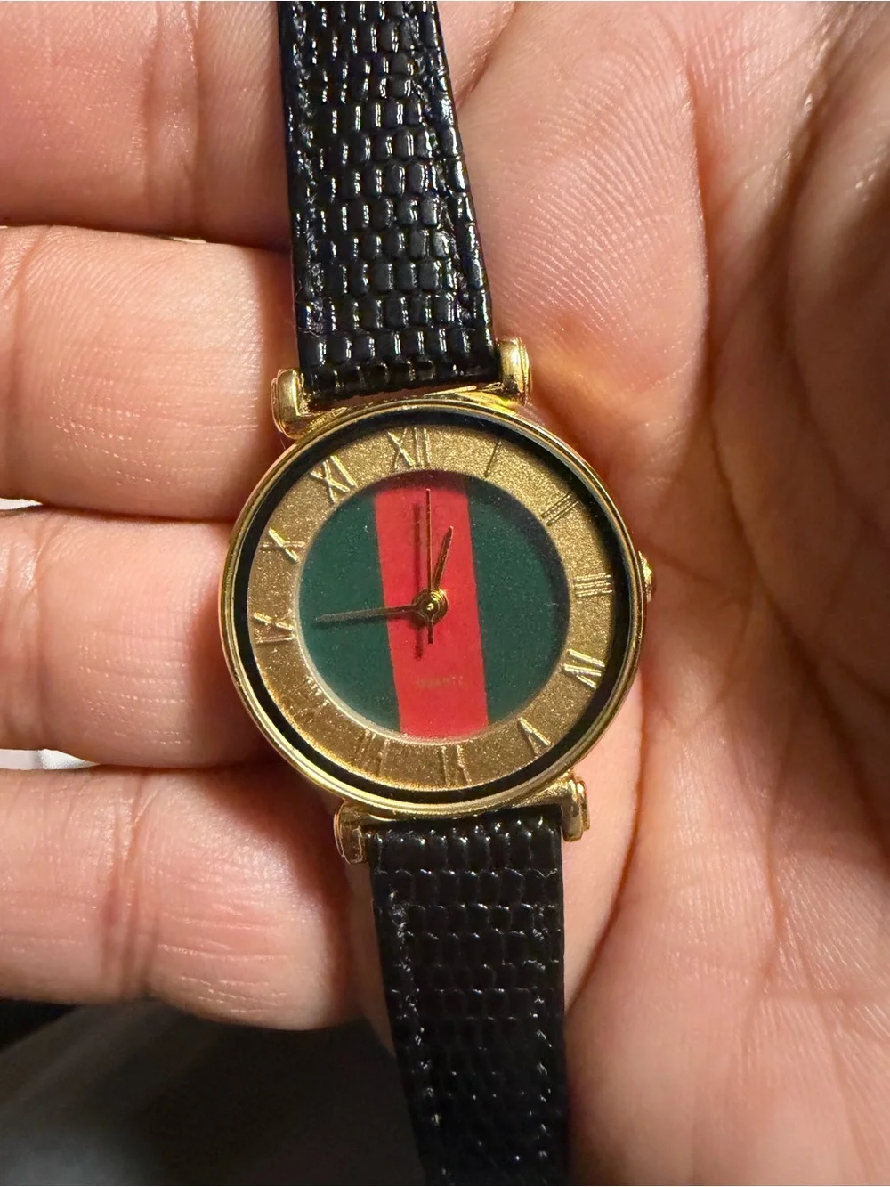 Gold-Tone Watch with Black Strap and Green-Red Dial
